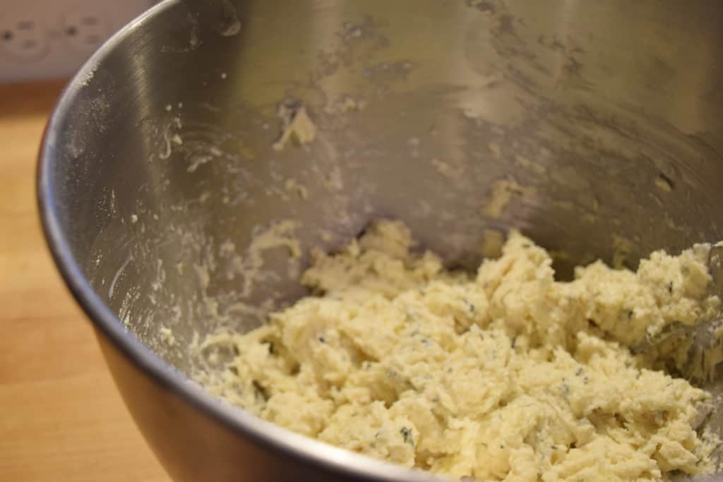 Buttermilk drop biscuits dough in a metal bowl.