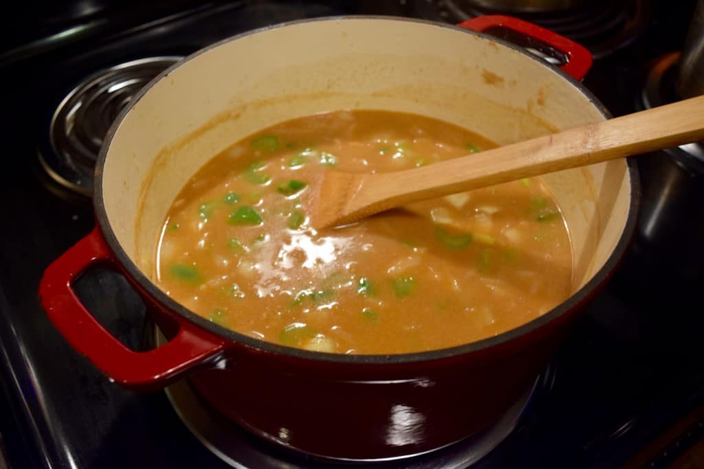 Making cajun chicken stew. 