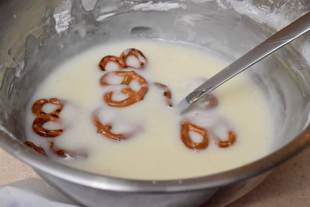 dipping pretzels into yogurt mixture.