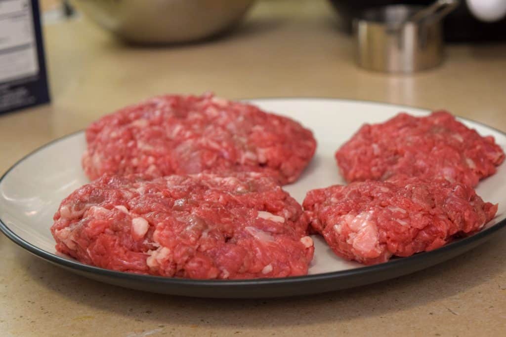 Irish pub burgers are a delicious way to celebrate St. Patty's Day! These beef burgers have Irish Cheddar, a homemade stout bbq sauce, and bacon on them. Serve with boiled salted potatoes. This Irish pub burger recipe is pretty simple and definitely delicious. Find the recipe on The Beard and The Baker. 
