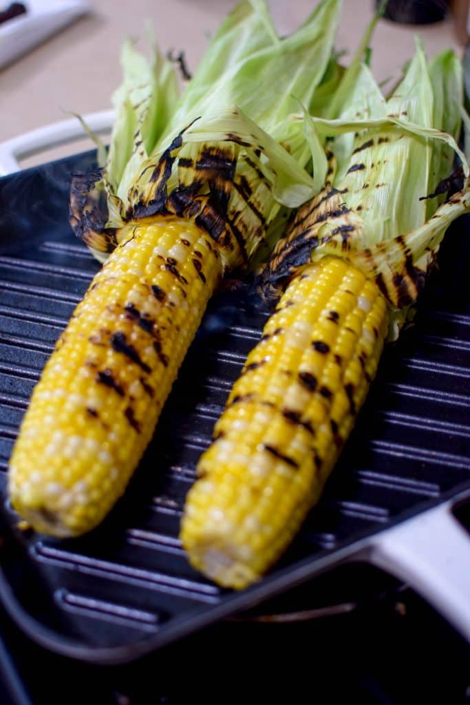 This homemade elote aka Mexican Street Corn is so delicious an so easy to make! It's the most perfect way to spend a summer afternoon. Load it up with your favorite toppings like bacon and chorizo! 