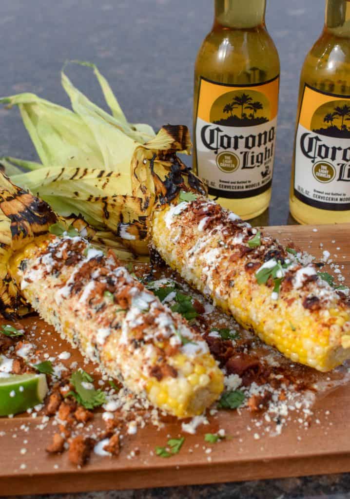 This homemade elote aka Mexican Street Corn is so delicious an so easy to make! It's the most perfect way to spend a summer afternoon. Load it up with your favorite toppings like bacon and chorizo!