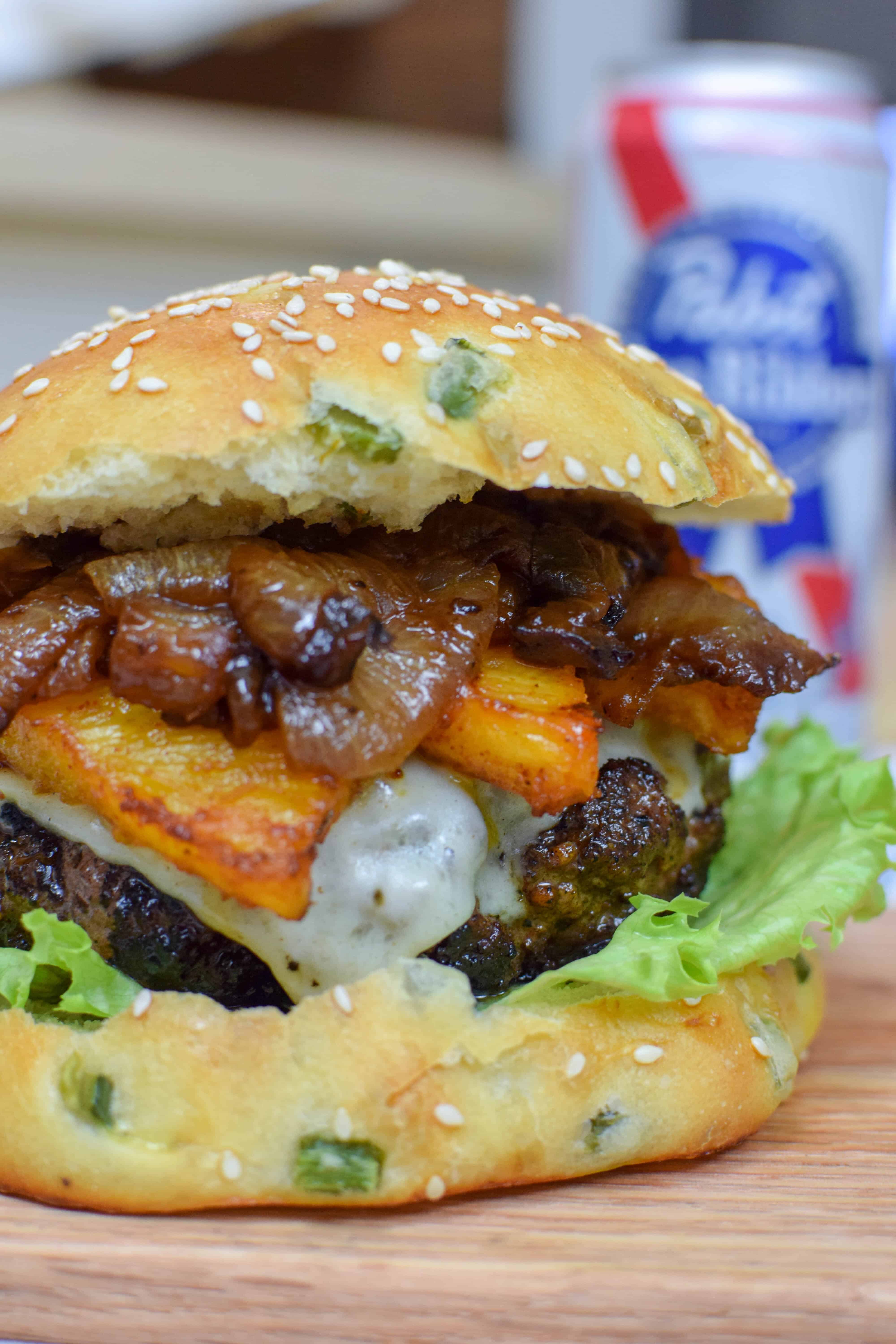 The most wonderfully tasty burger with a homemade jalapeño bun, roasted pineapple and caramelized onions. This burger is perfect for grilling season, spicy and sweet and delicious!