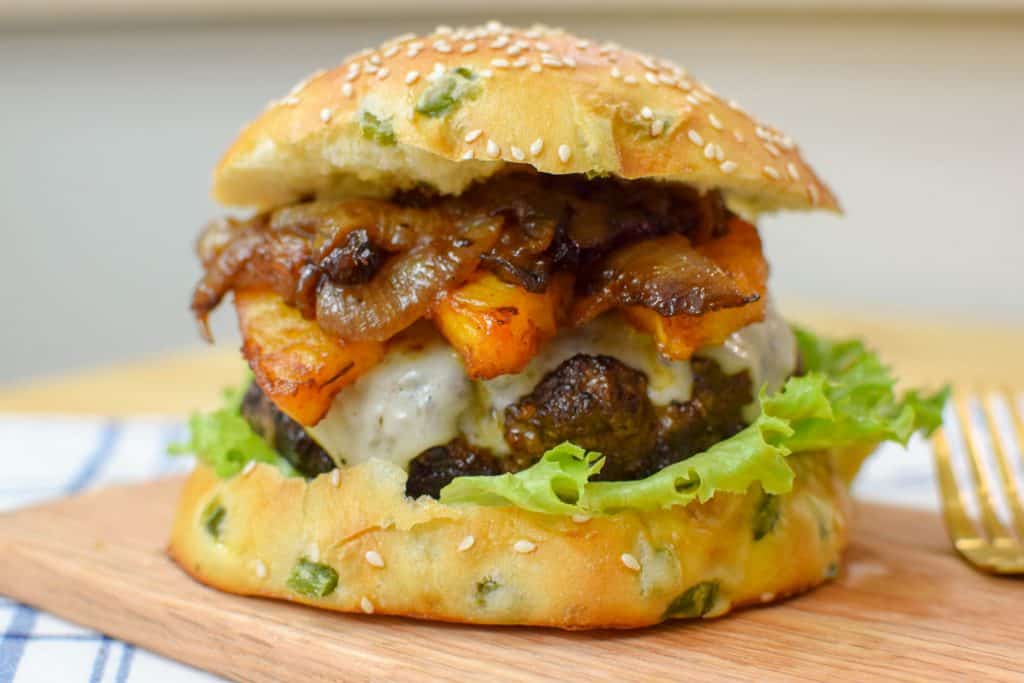 The most wonderfully tasty burger with a homemade jalapeño bun, roasted pineapple and caramelized onions. This burger is perfect for grilling season, spicy and sweet and delicious!