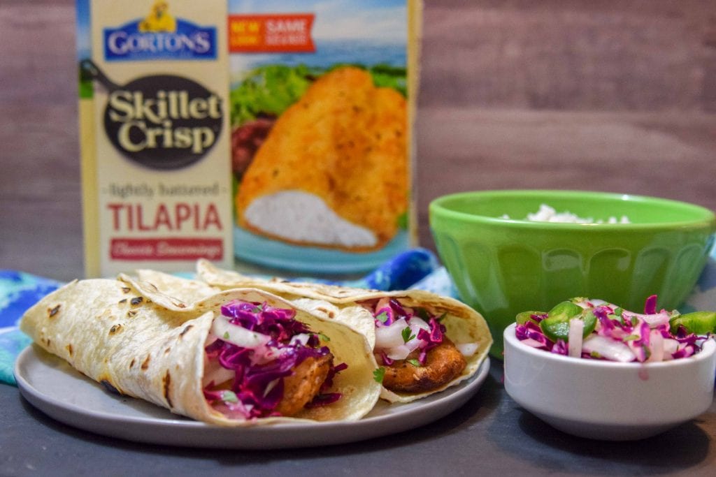 Air fryer tilapia topped with no mayo red cabbage slaw to make delicious fish tacos. 