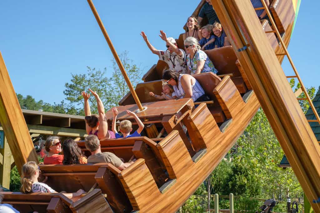Pirate ship ride going up high.