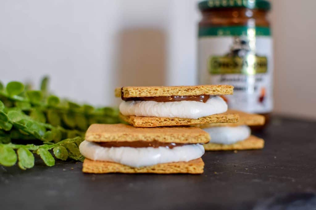 These homemade indoor s'mores are so easy to make and are a no mess dessert! Use chocolate spread and bake in the oven for a super simple and delicious dessert. 