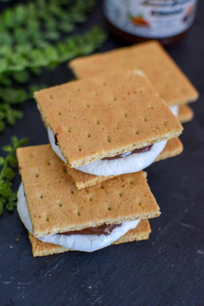 These homemade indoor s'mores are so easy to make and are a no mess dessert! Use chocolate spread and bake in the oven for a super simple and delicious dessert. 
