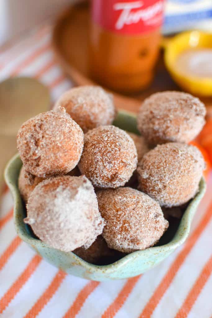 Pumpkin Donut holes coated with cinnamon and sugar.