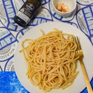 Homemade pasta made with olive oil, chili flakes, garlic and bucatini.