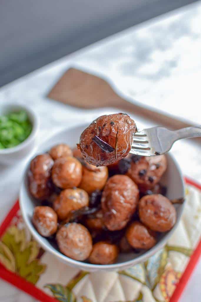 These homemade grilled small potatoes are made with lamb bacon and green onions! They are the most delicious side dish for your summer cookout. 