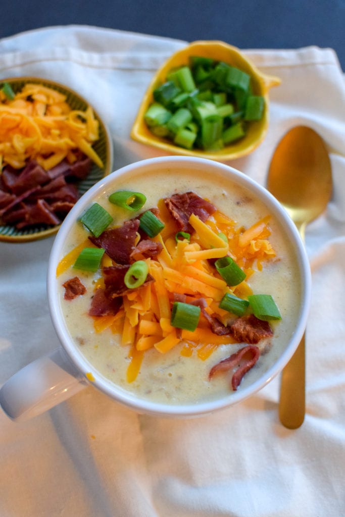 This loaded baked potato soup is delicious and SO easy! It's made in a crock pot, so you can leave it for a few hours and also make your house smell divine.