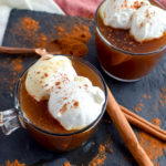Chaider is a delightfully warm seasonal drink that pairs apple cider with chai tea! It's easy to make and extra delicious topped with whipped cream and cinnamon.