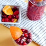 This winter sangria mocktail recipe is incredibly simple to make, absolutely delicious, and filled with fruit like pears, cranberries, oranges, and raspberries! It's perfect for a small crowd or just for one.