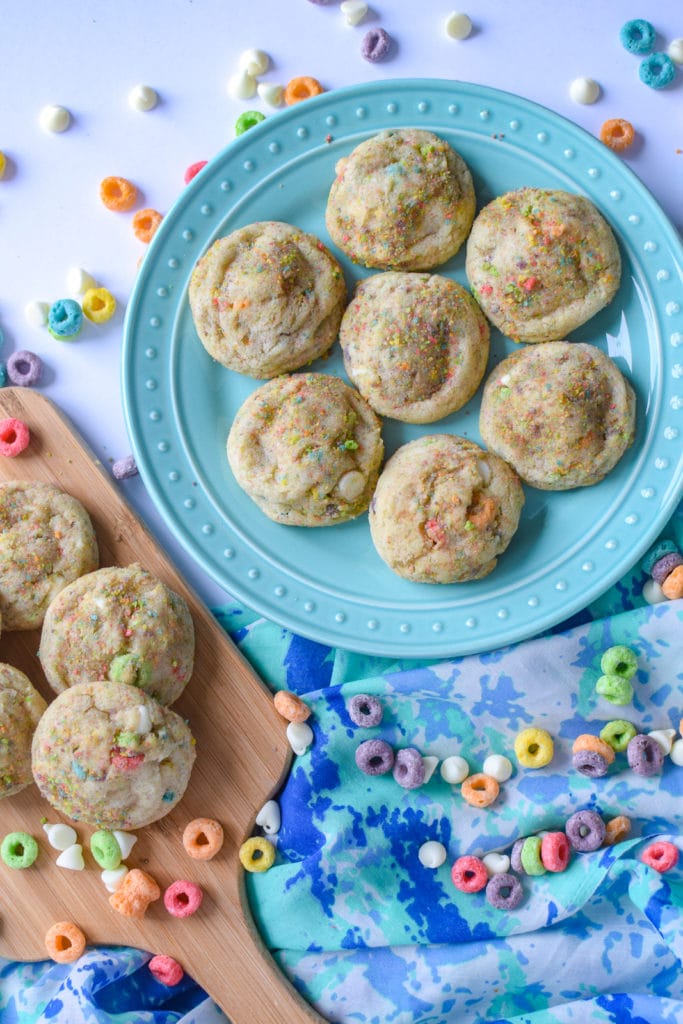 Cookies on a plate surrounded by froot loops.