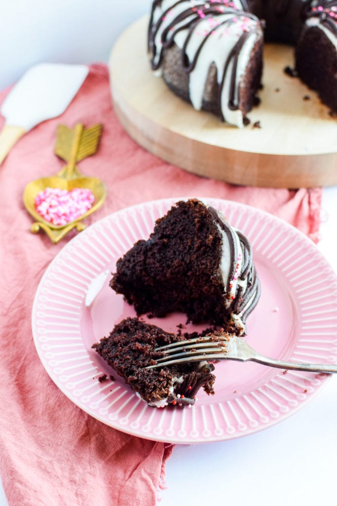 Slice of bundt cake being cut with fork.