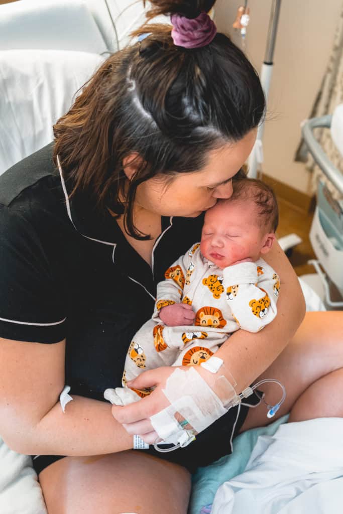 Mother with newborn in hospital.