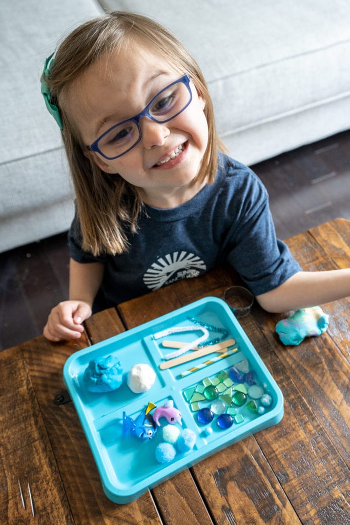 Child doing Earth day craft activity.