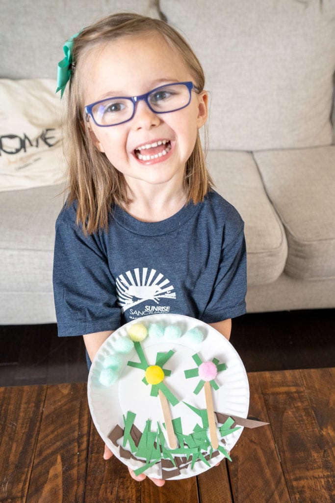 Child doing earth day crafts.