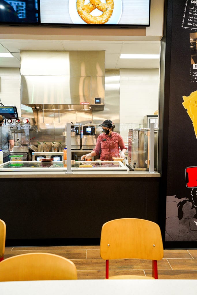 Employee making food fresh to order at Sheetz.