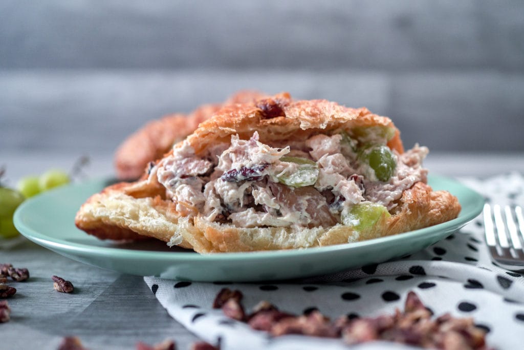 Inside closeup of chicken salad on a fresh croissant.