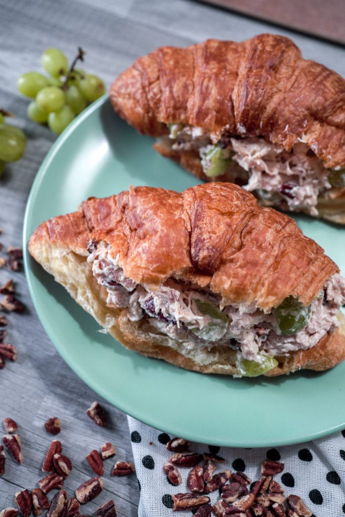 Two chicken salad sandwiches on a fresh croissant.