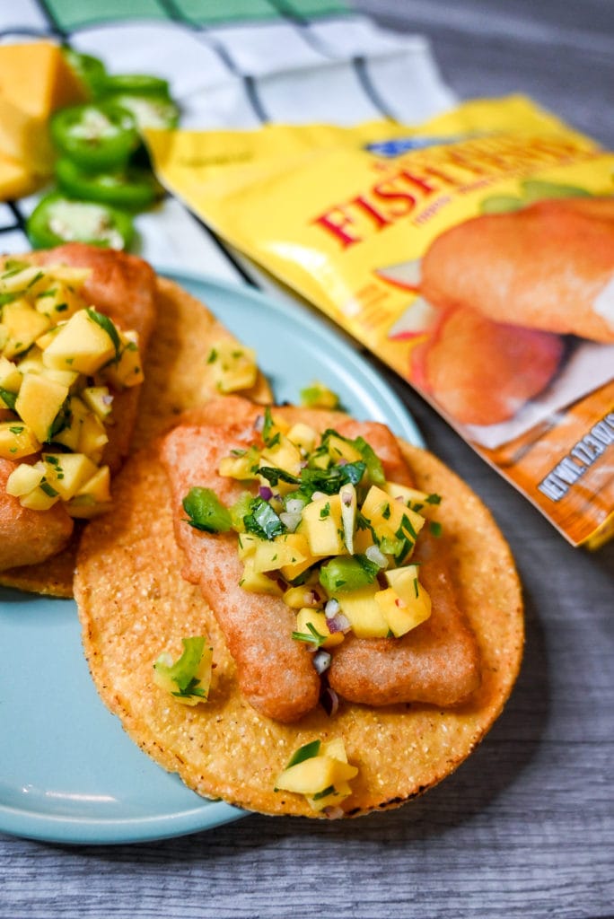 Plated Air fried gortons fish tostadas with mango salsa.