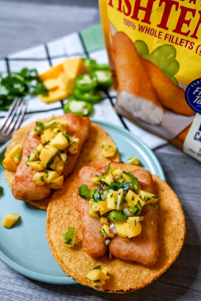 Plated Air fried gortons beer battered fish tostadas with mango jalapeno salsa.