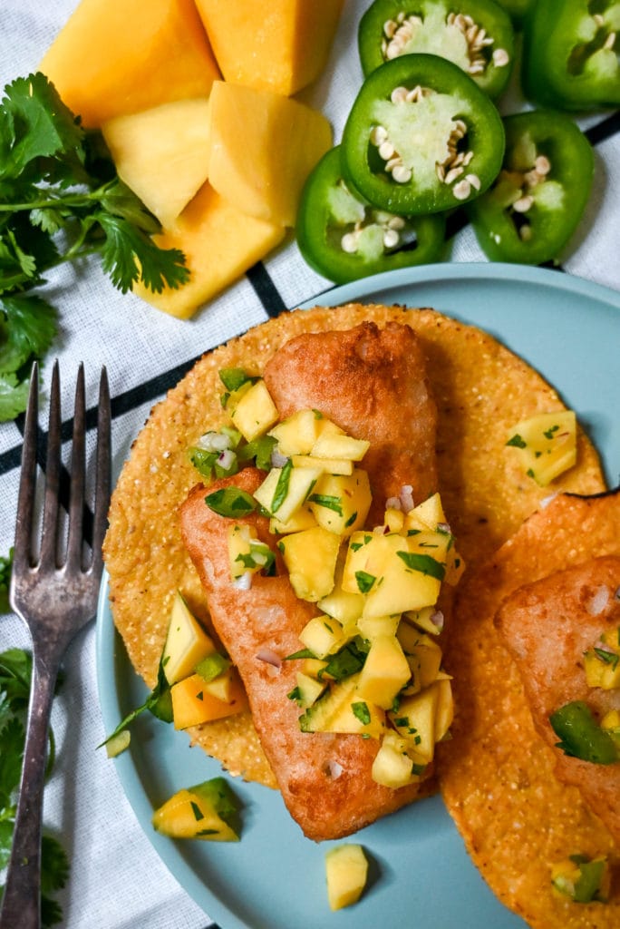 Close up of Air fried gortons fish tostadas with mango salsa.