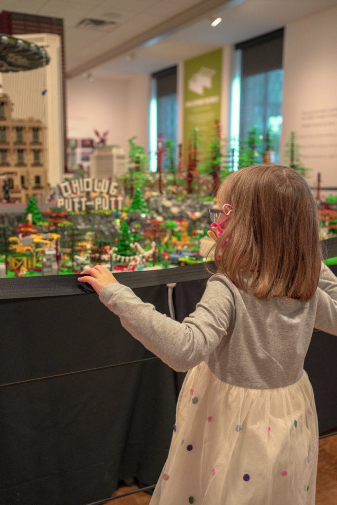 Child looking at lego exhibit at the Columbus Museum Of Art.