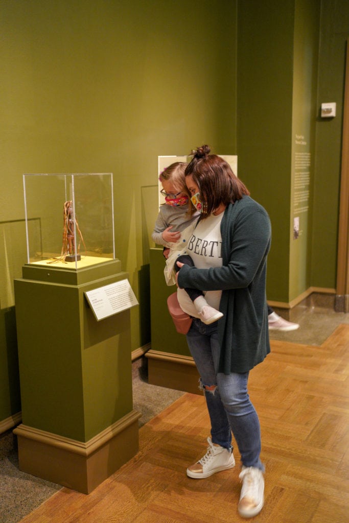 Family browsing artifacts at the museum.