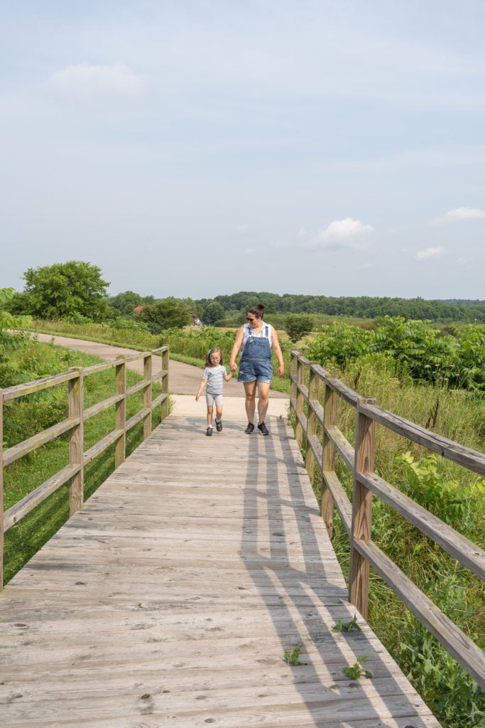 Mother and daughter walking along path in Newark, Ohio.