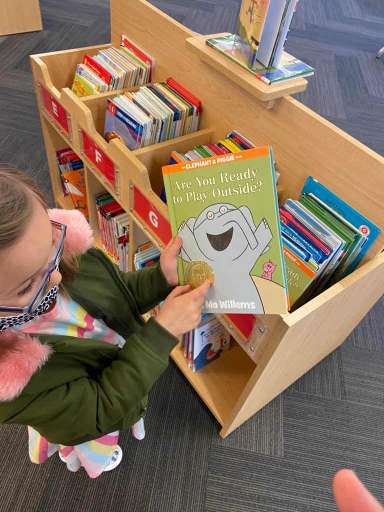 Child picking out books at the library in Columbus, Ohio.