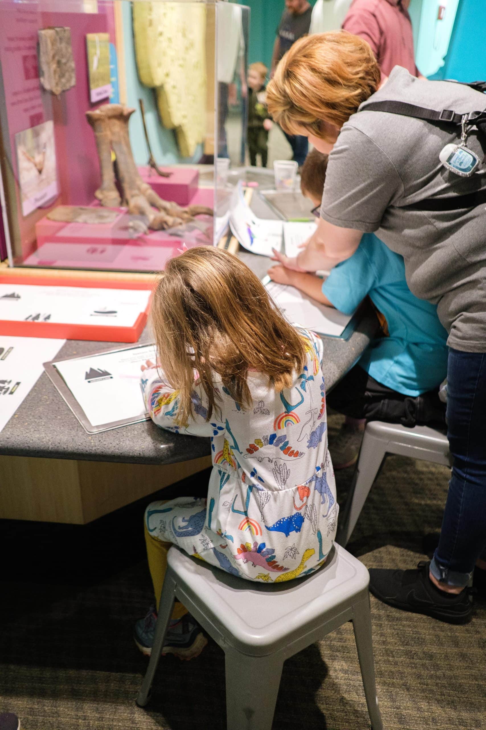 Kids doing activities inside of the Children's Museum Of Indianapolis.