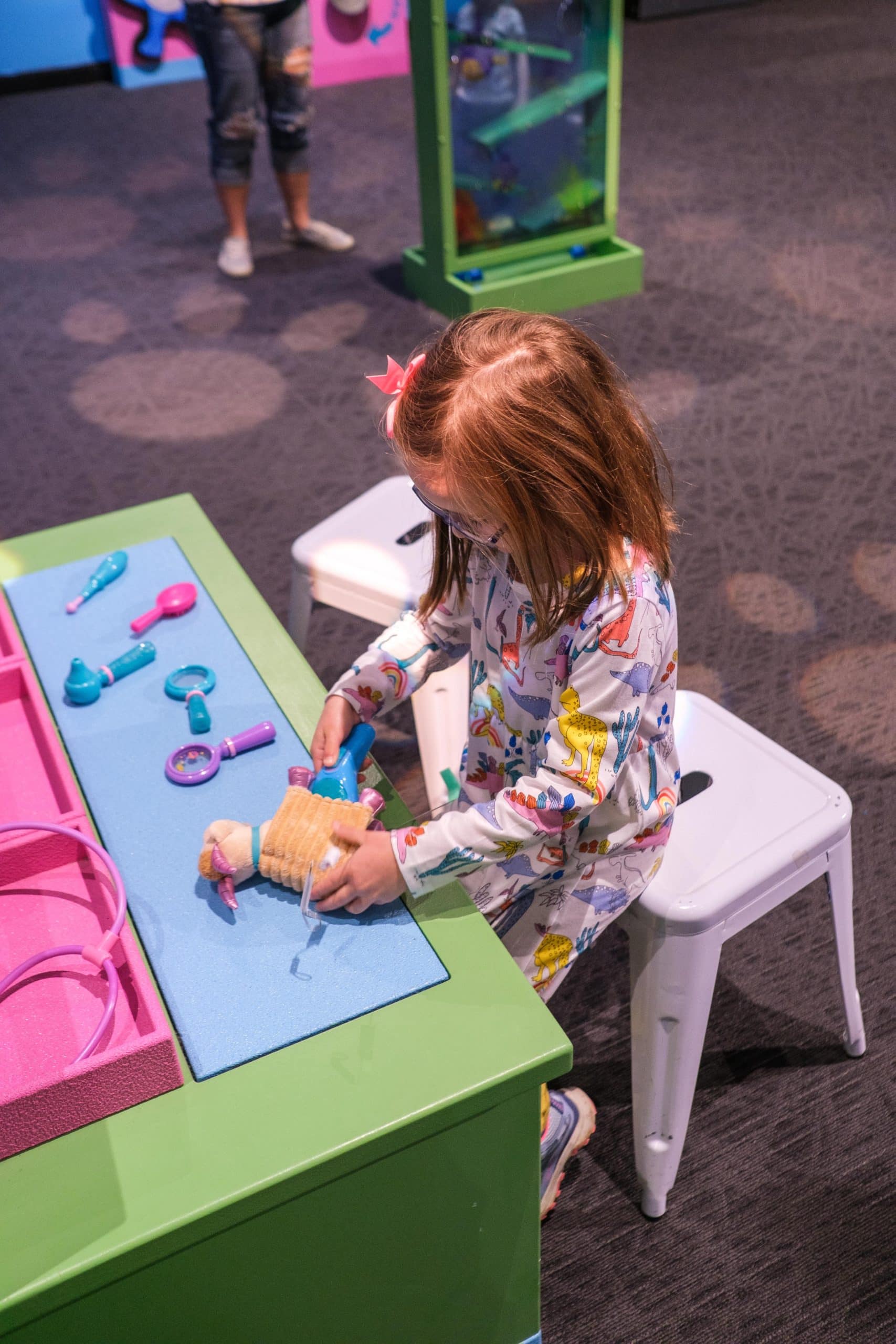 Child at a veterinary exhibit for Doc McStuffins at the Children's Museum Of Indianapolis.