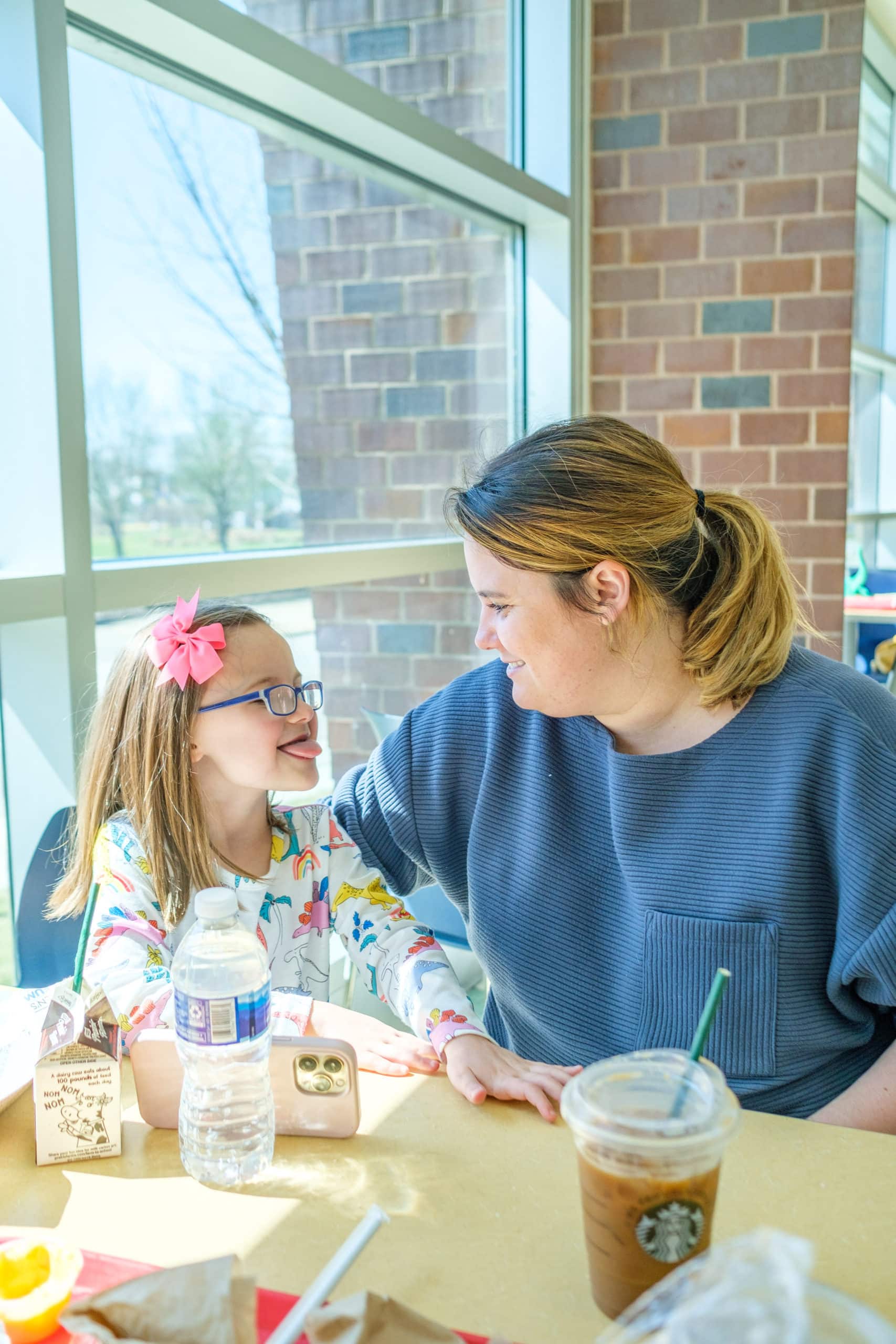 Mother and daughter having lunch inside of the Children's Museum Of Indianapolis.