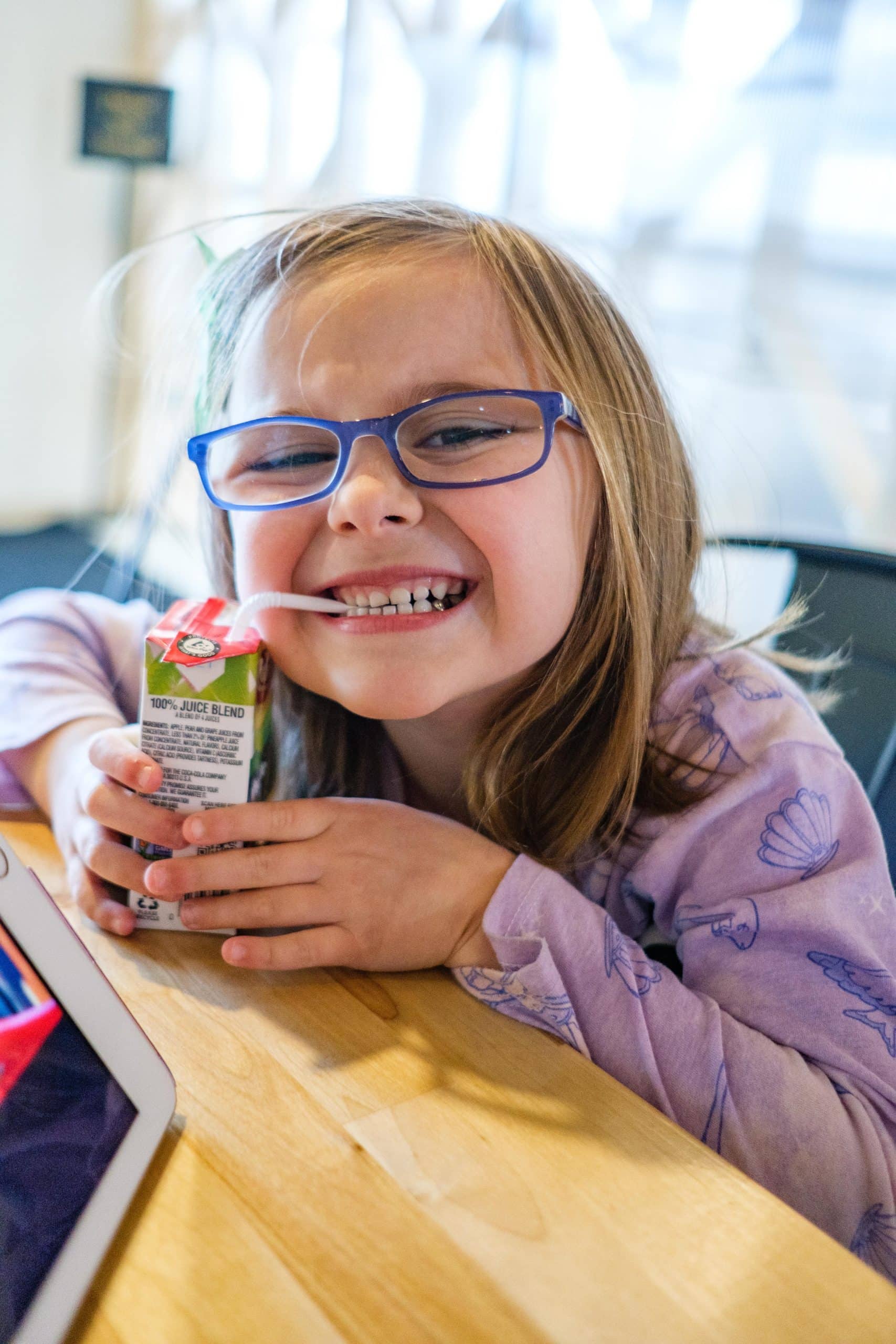 Child enjoying apple juice while seated at Sexton's Pizza in Hilliard, Ohio.
