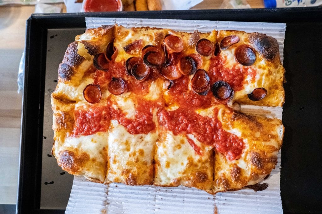 Pepperoni and cheese Detroit style pizza shown on pan at Sexton's Pizza in Hilliard, Ohio.