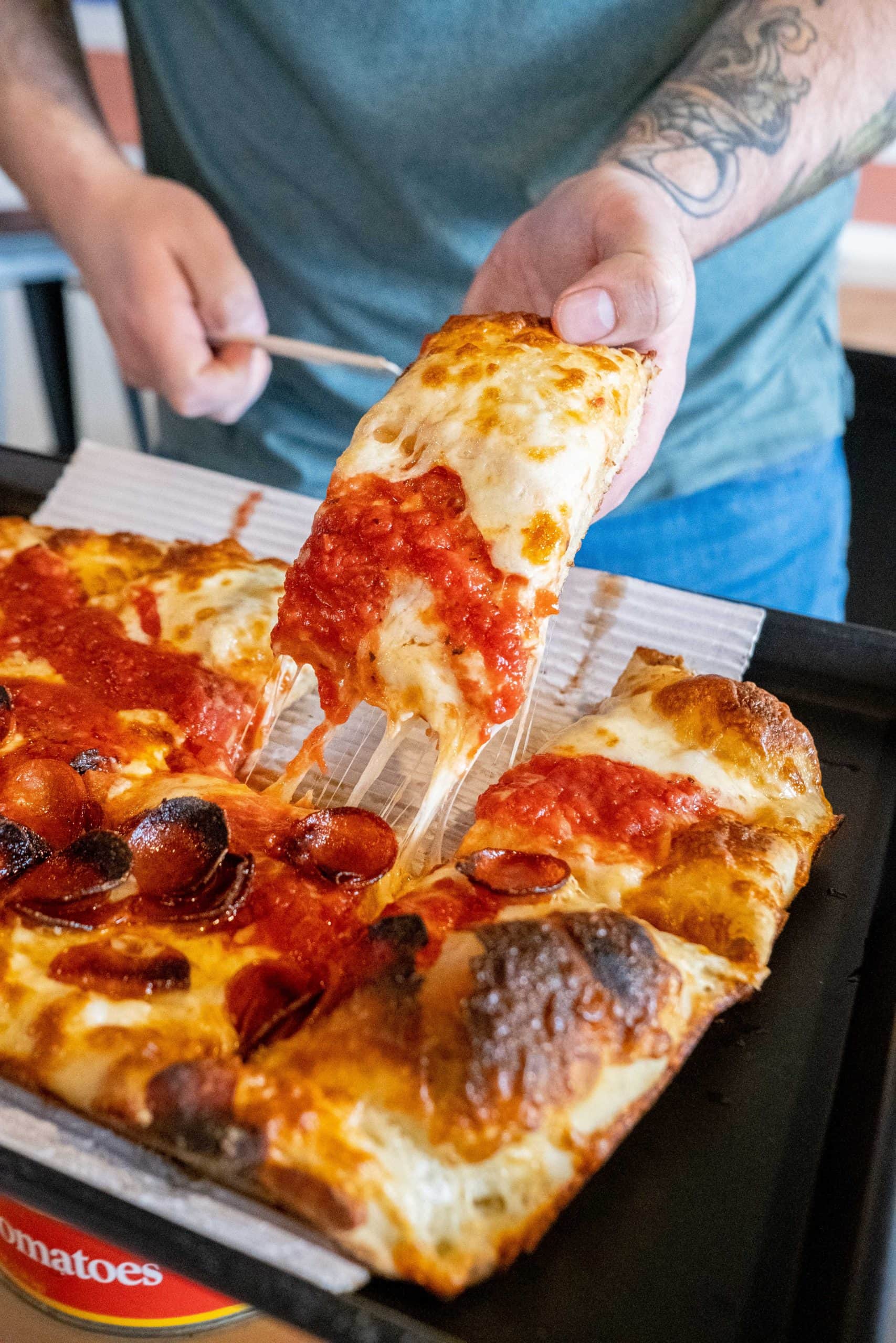 Cheese pull of deep dish pizza at Sexton's Pizza in Hilliard, Ohio.