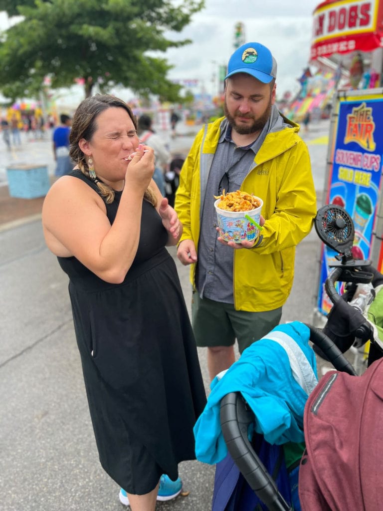 Family sharing cheese fries at Ohio State Fair.