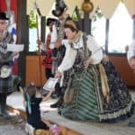 The Queen at the Ohio Renaissance Festival crowning a child during the fun ceremony.