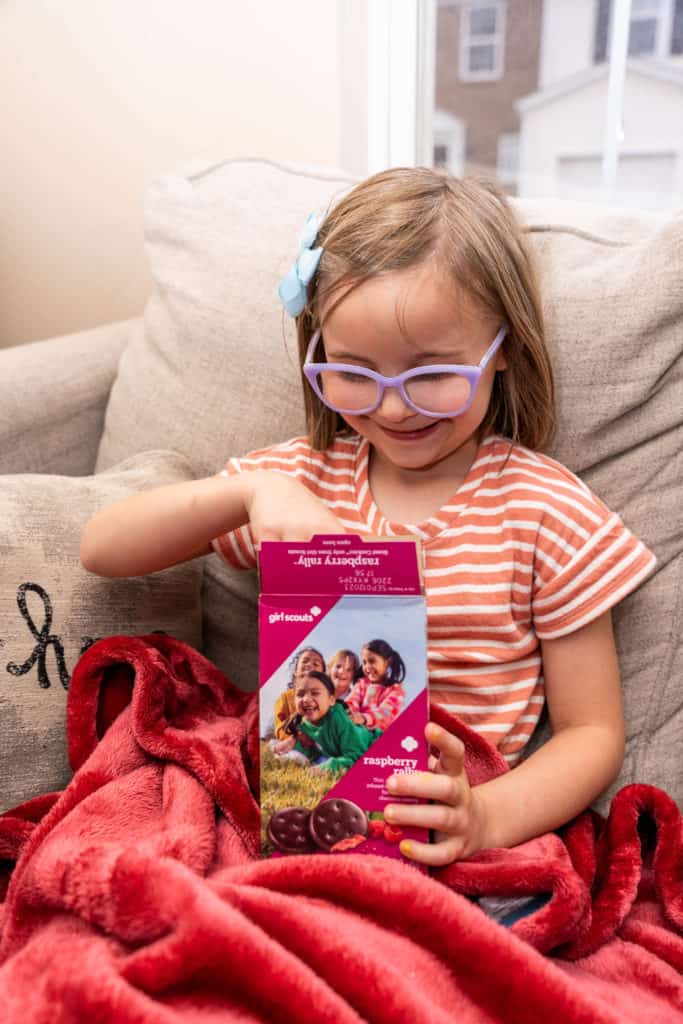 Young girl enjoying the the new Girl Scout cookie, raspberry rally.