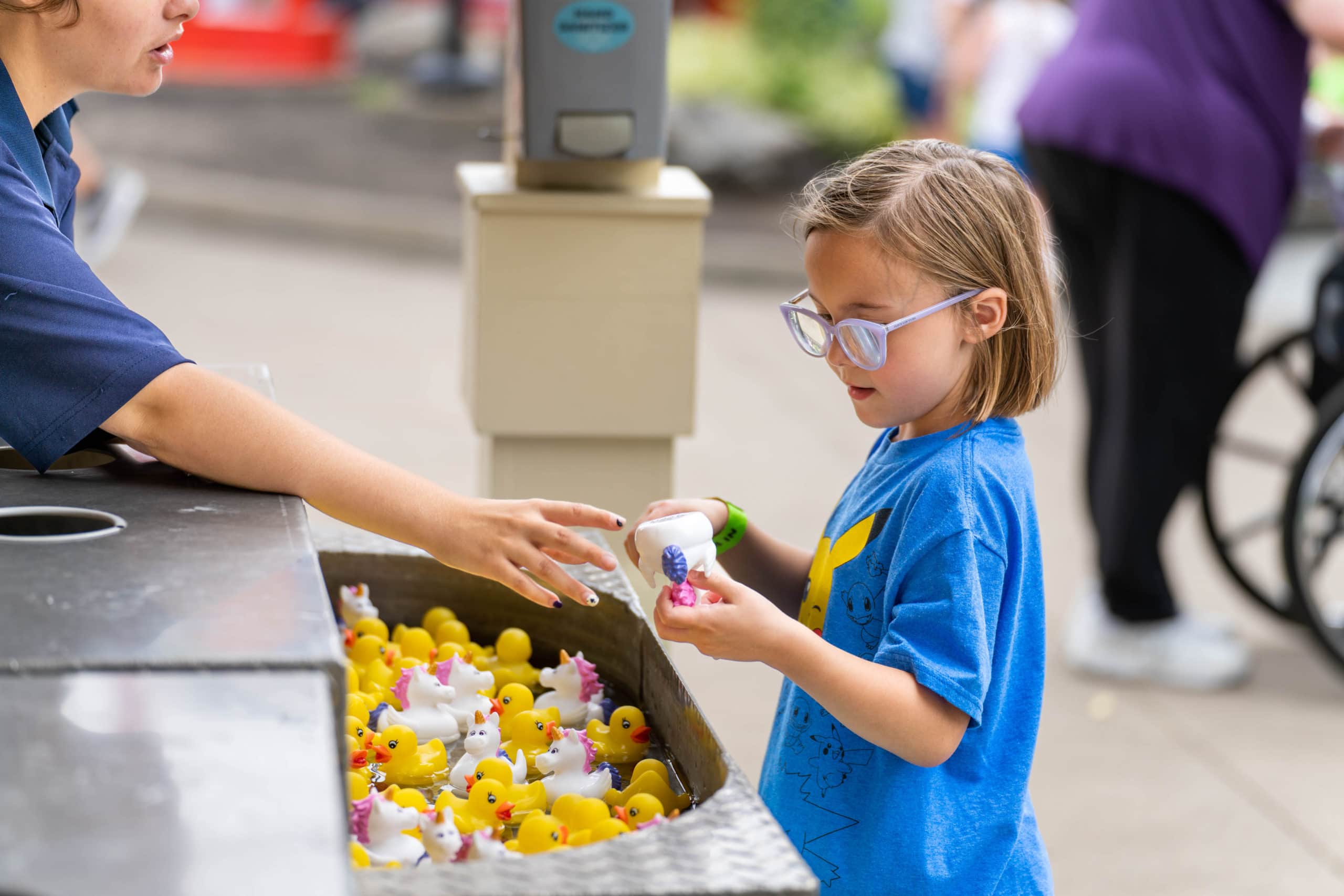 Young girl playing rubber ducky game at Kings Island in Mason, Ohio.