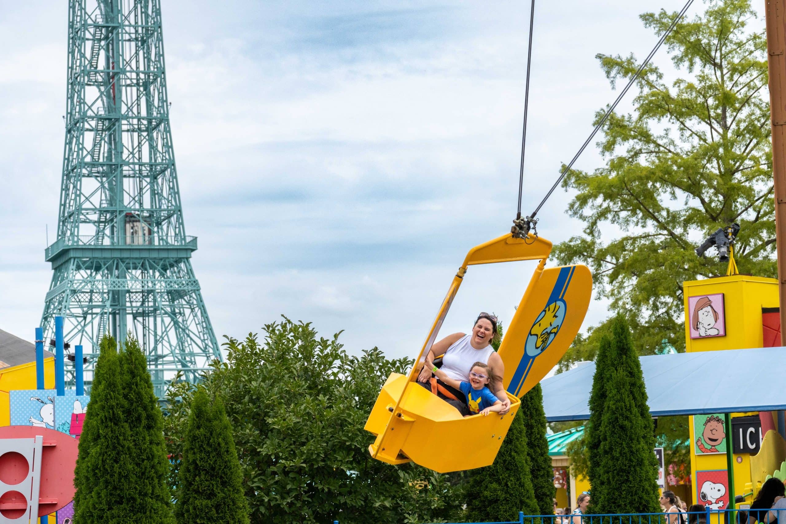 Mom and daughter enjoying the Woodstock Flyers ride at Kings Island in Mason, Ohio.
