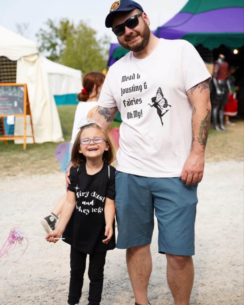 Father and daughter in custom t-shirts during the Ohio Renaissance Festival.