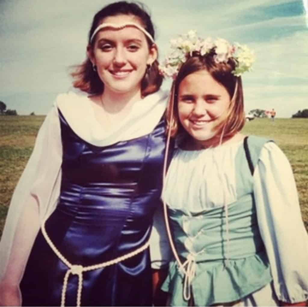 Two sisters in medieval clothing enjoying the Renaissance Festival.