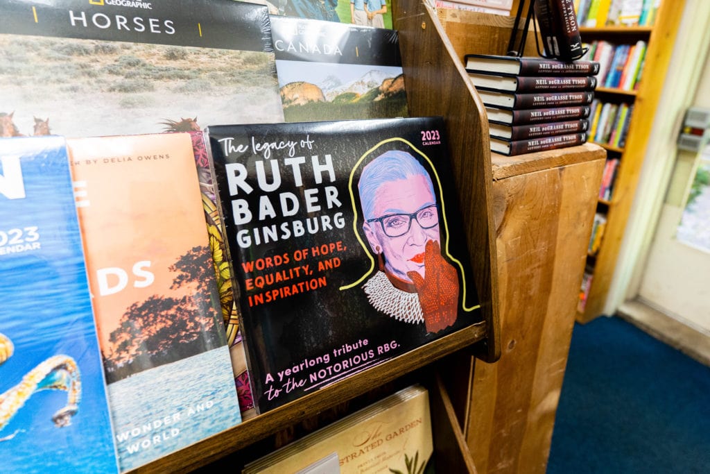 The Legacy Of Ruth Bader Ginsberg calendar on a rack for sale at The Book Loft in German Village.