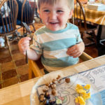 Toddler boy eating the breakfast buffet at Der Dutchman in Plain City, OH.