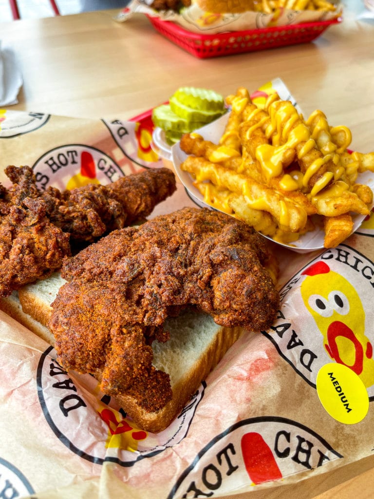 Hot chicken tenders at Dave's Hot Chicken and cheese fries. 