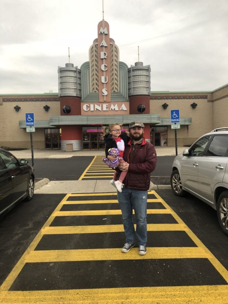 Father and daughter at Marcus Cinema movie theatre in Columbus Ohio. 